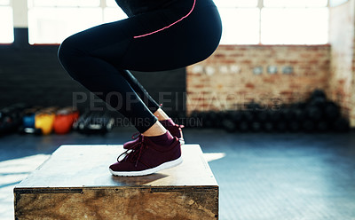 Buy stock photo Shot of an unrecognizable woman doing a exercise jump on a wooden block in a gym