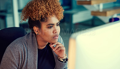 Buy stock photo Shot of a young businesswoman working late in an office