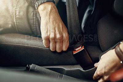 Buy stock photo Closeup shot of an unrecognizable man fastening his seatbelt in a car