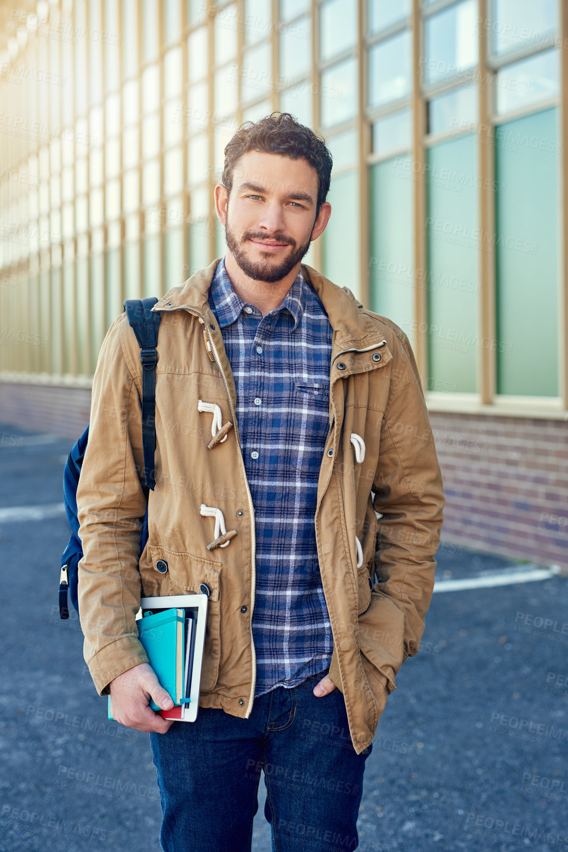 Buy stock photo Shot of a college student between classes on campus grounds