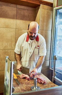 Buy stock photo Butcher, man and cleaver for cutting for order, nutrition and protein product at small business. Person, factory or slaughterhouse with blade, knife and process for food, chops or production in Italy