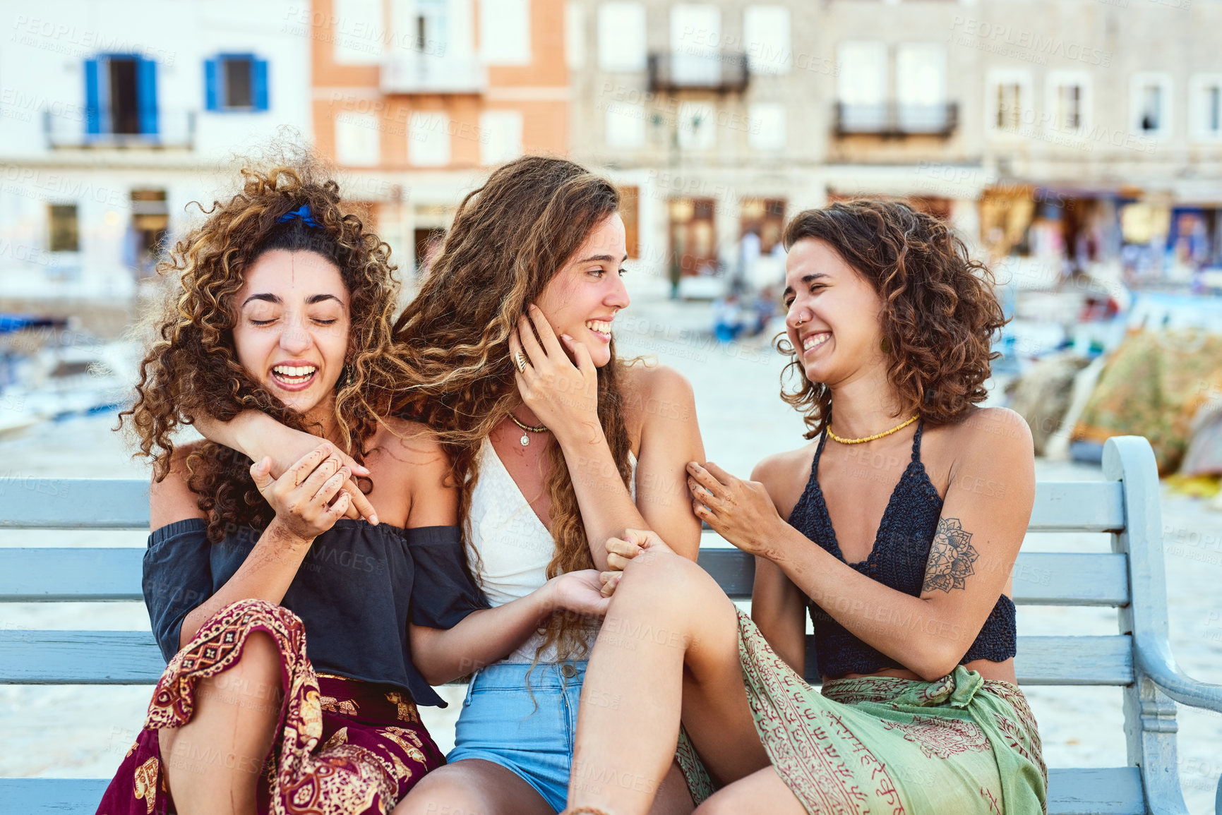 Buy stock photo Travel, laugh and women in city in conversation for summer holiday, vacation and adventure together. Happy, bench and friends talking, chat and relax for journey, bonding and tourism in Barcelona