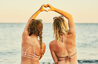Buy stock photo Rearview shot of unrecognizable women at the beach