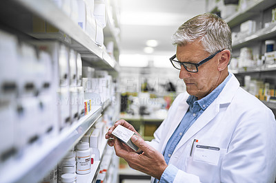 Buy stock photo Pharmacy, medicine and check with man at shelf in drug store for label, inspection and inventory. Medical, healthcare and pills with male pharmacist in clinic for expert, wellness and product check