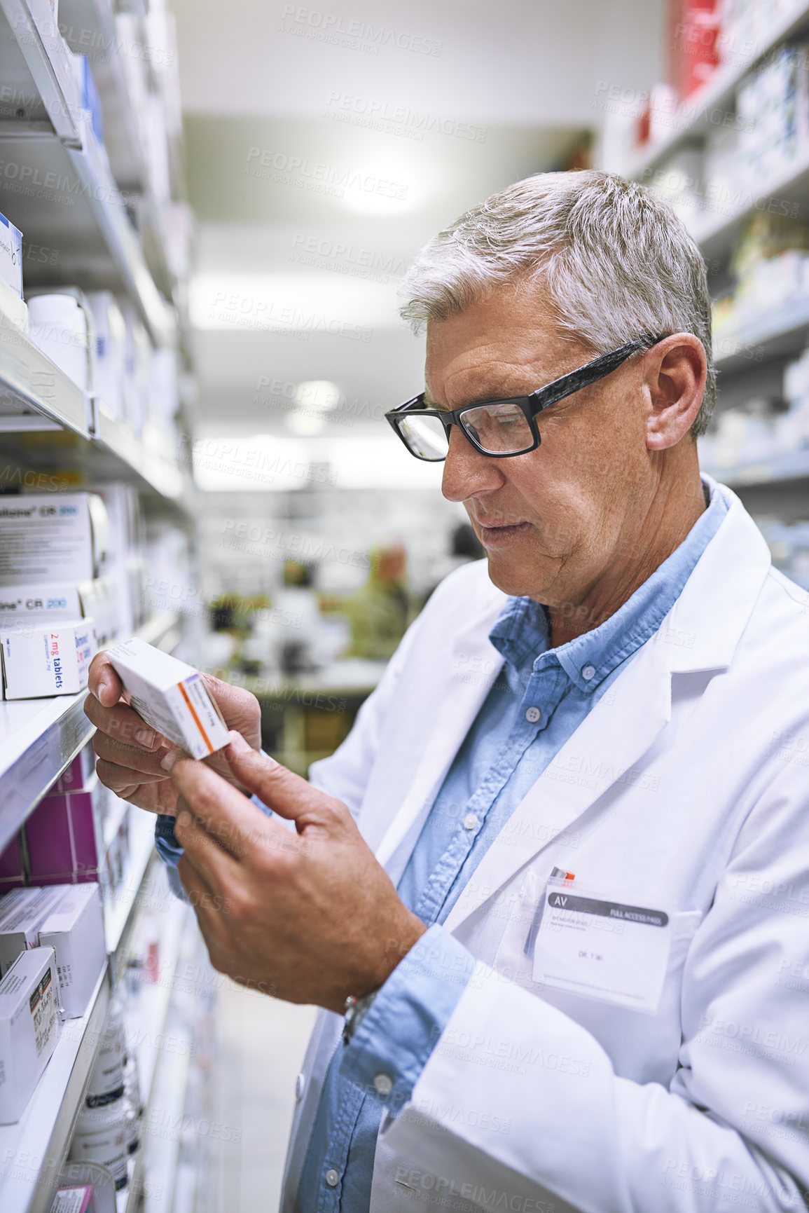 Buy stock photo Pharmacy, medicine and reading with man at shelf in store for inspection, search and inventory. Medical, healthcare and pills with senior male pharmacist in clinic for expert, wellness and product