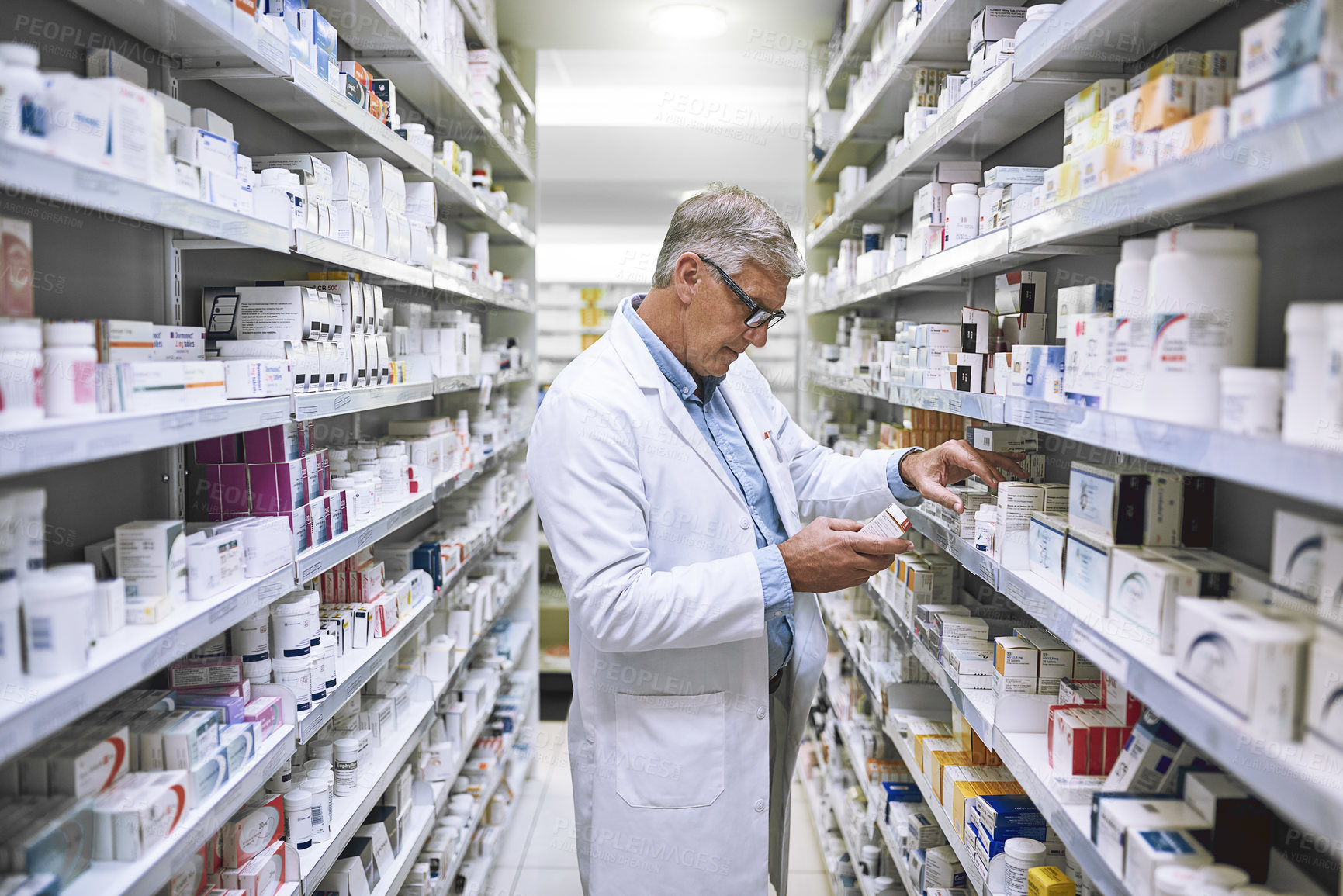 Buy stock photo Pharmacy, medicine and search with man at shelf in drug store for thinking, inspection and inventory. Medical, healthcare and pills with senior male pharmacist for expert, wellness and product