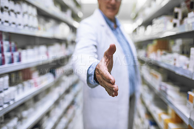 Buy stock photo Man, doctor and handshake at pharmacy for greeting, introduction or hello at healthcare clinic. Male person or medical expert shaking hands for health, pharmaceutical or medication advice at store
