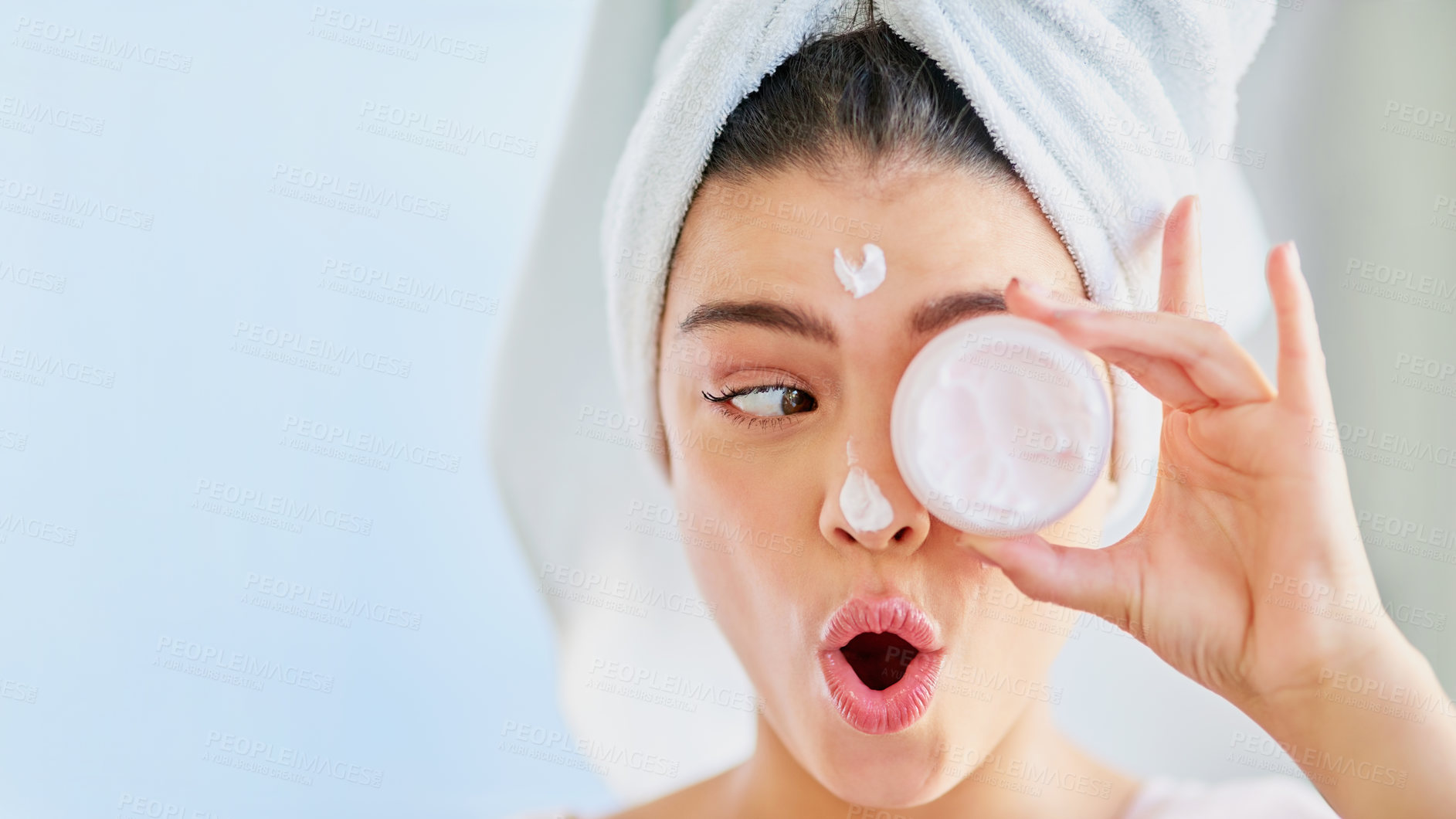 Buy stock photo Funny face, moisturizer or woman in bathroom with beauty, glow or wellness with humor or joke. House, towel and girl with mock up space, cosmetics results or skincare cream with health and lotion