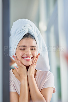 Buy stock photo Cropped portrait of a beautiful young woman getting ready in the bathroom mirror at home
