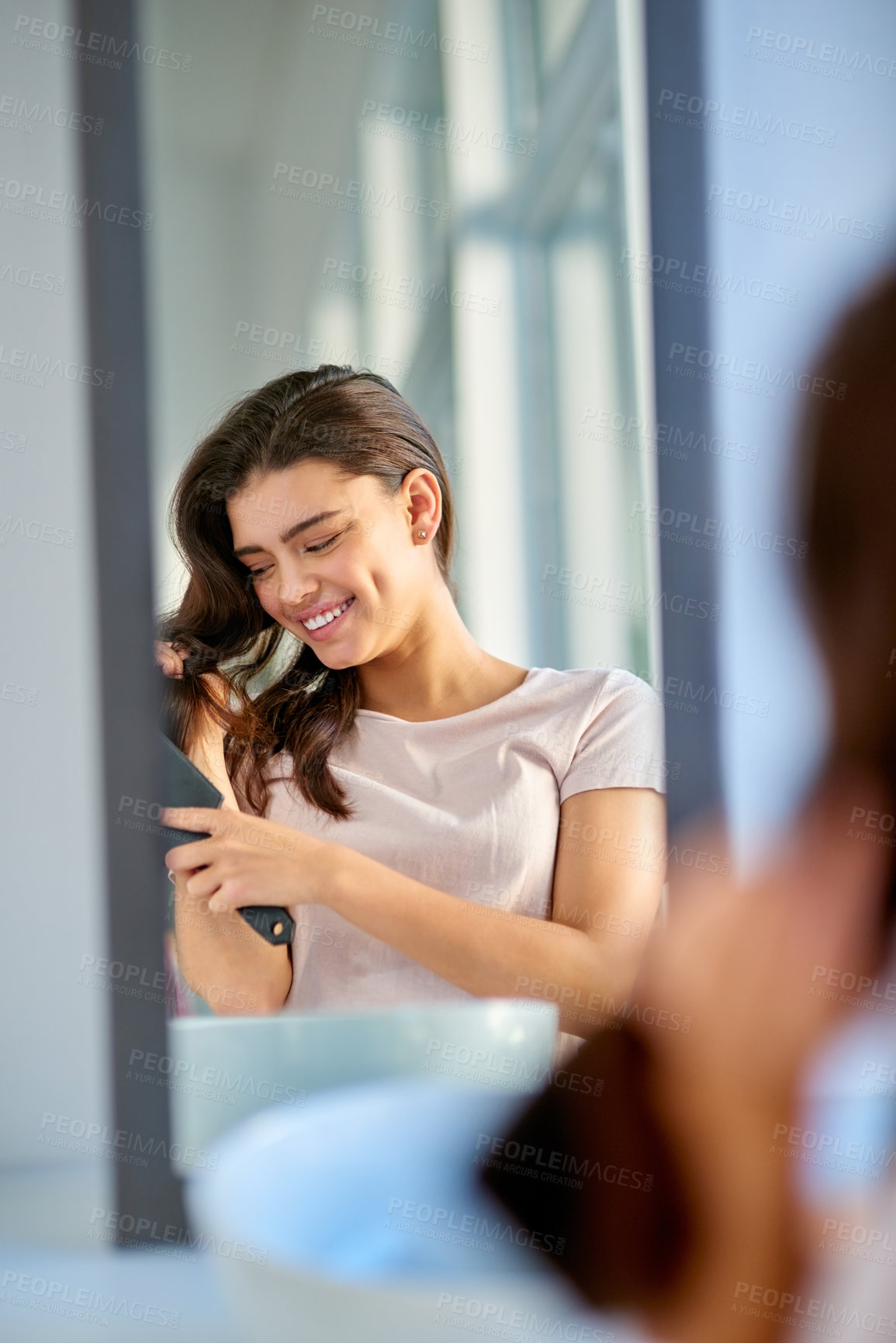 Buy stock photo Woman, mirror and brushing hair in home, grooming and morning for getting ready in bathroom. Female person, cosmetics tool and hairbrush for hairstyle, reflection and treatment for healthy growth