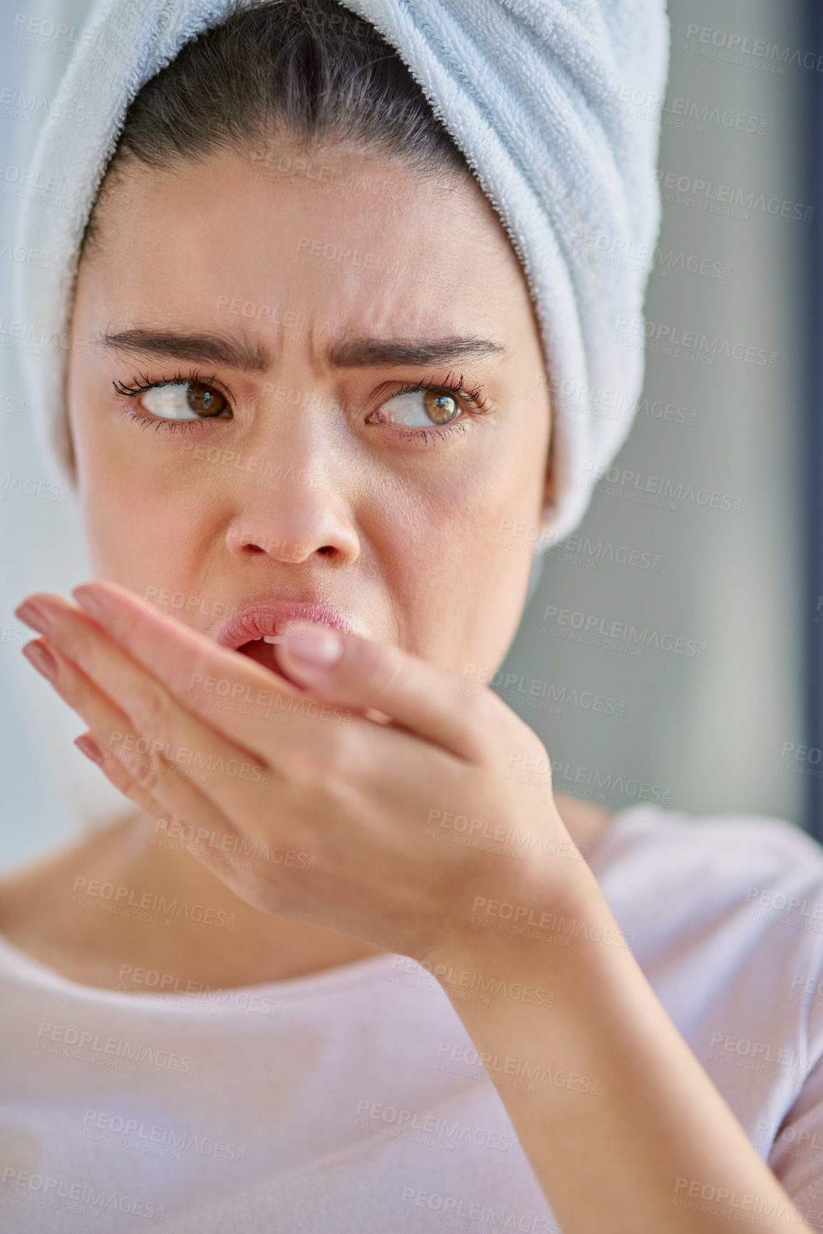 Buy stock photo Dental, woman and check bad breath for problem, caries or disgust for halitosis in home bathroom. Cover mouth, oral hygiene and smell for health, odor test and gingivitis or bacteria for gum disease