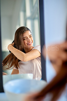 Buy stock photo Woman, mirror and brushing in home portrait, grooming and morning for getting ready in Indonesia. Female person, cosmetics tool and hairbrush for hair care, bathroom and treatment for healthy growth