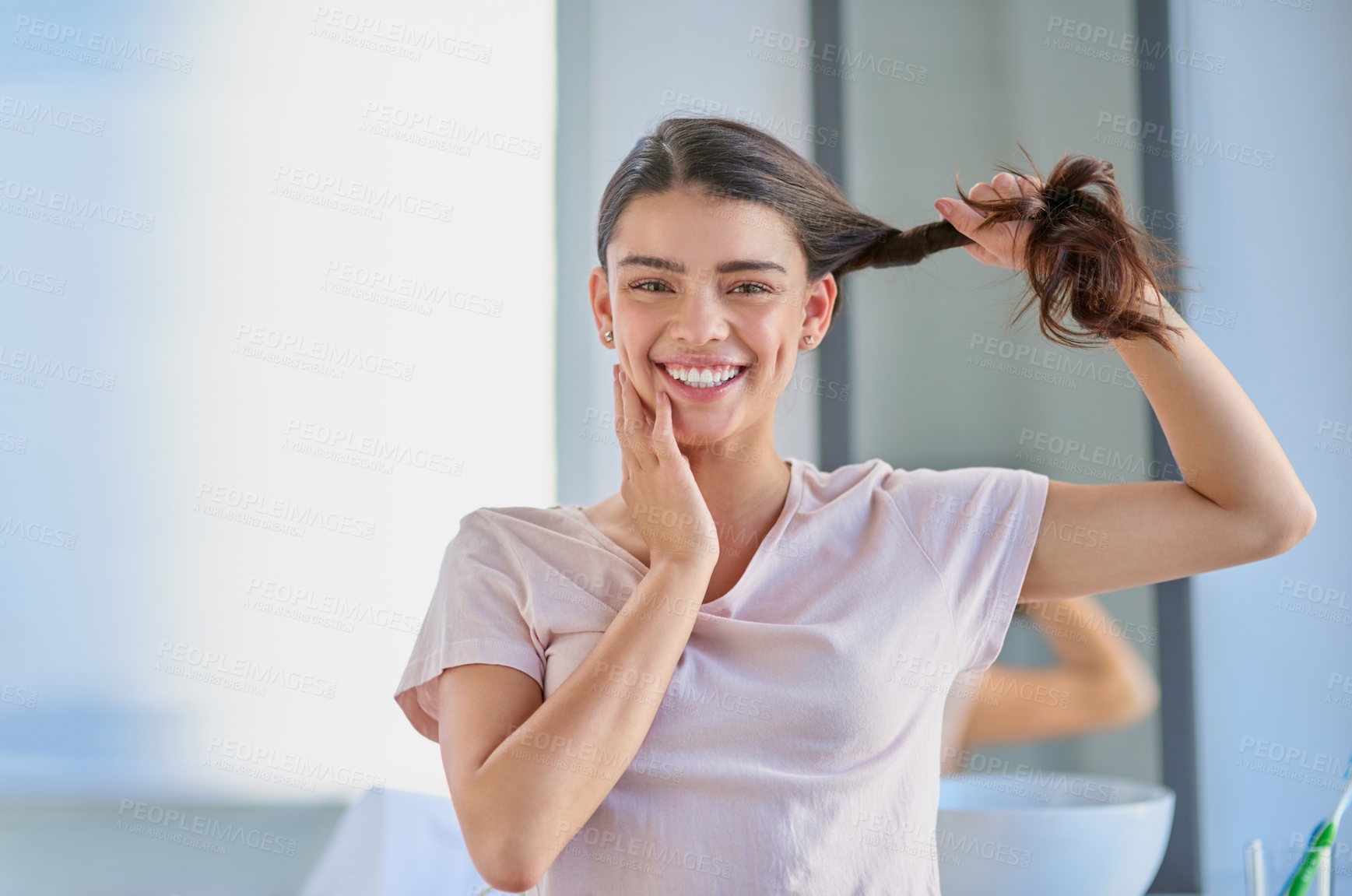 Buy stock photo Cropped portrait of a beautiful young woman stretching her gar out in the bathroom at home