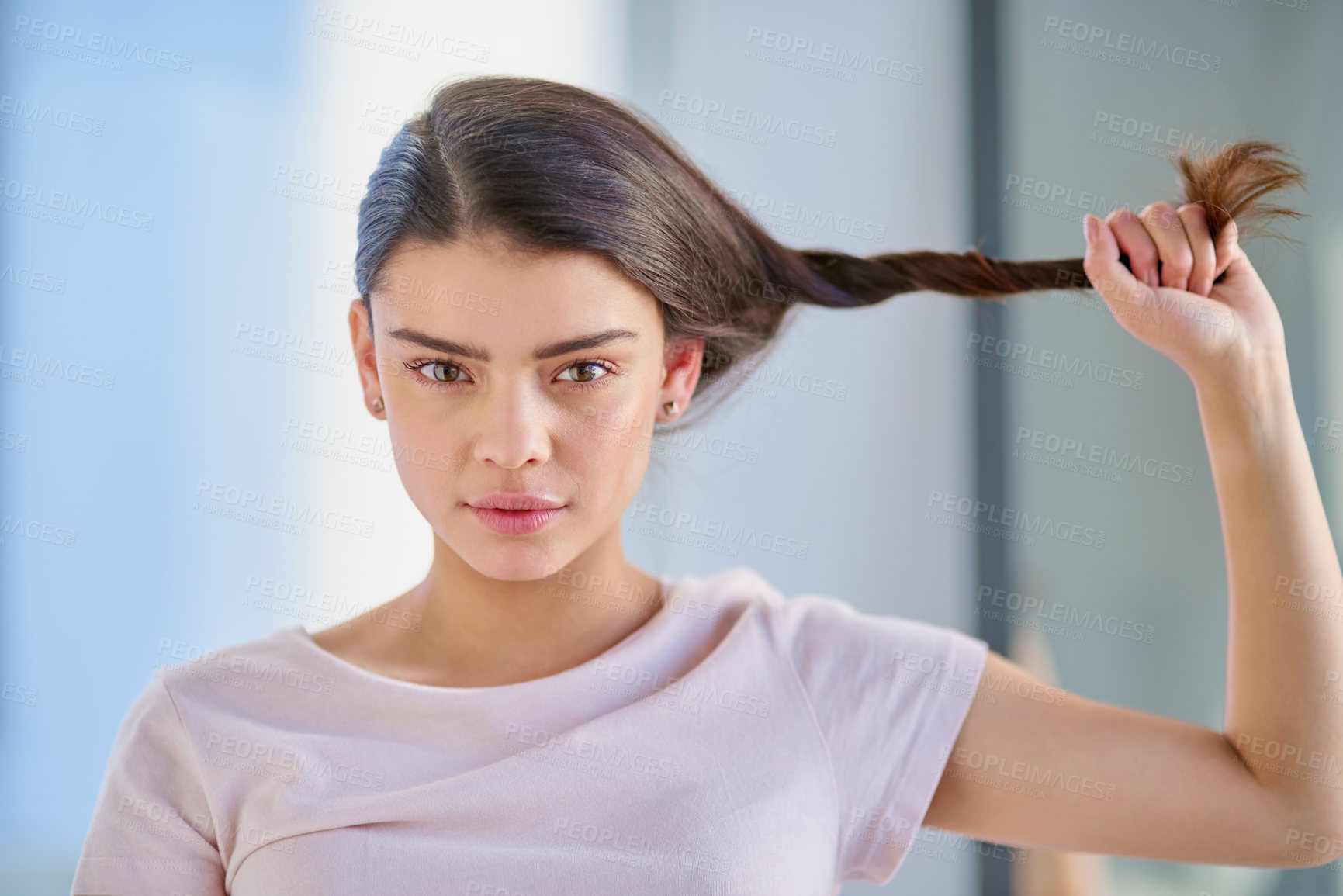 Buy stock photo Cropped portrait of a beautiful young woman stretching her gar out in the bathroom at home