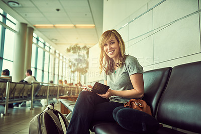 Buy stock photo Shot of a young woman waiting at the airport