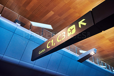 Buy stock photo Empty, airport and sign with direction for departure, arrival or boarding guide on international flight at travel station. Interior, label or billboard signage for gates, terminal or transportation