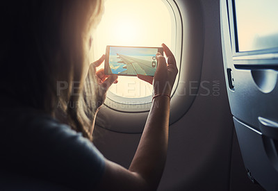 Buy stock photo Shot of a young person in an airplane