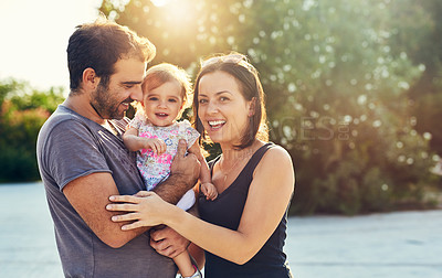 Buy stock photo Shot of a young family outdoors