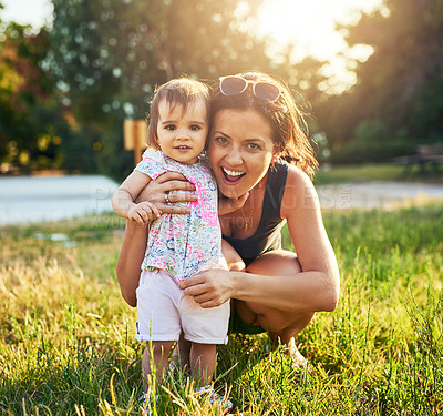 Buy stock photo Girl, baby and portrait with mom in garden for hug, support and exited for bonding, love and development in summer. Family, mother and daughter child with embrace, happy and care on grass in backyard