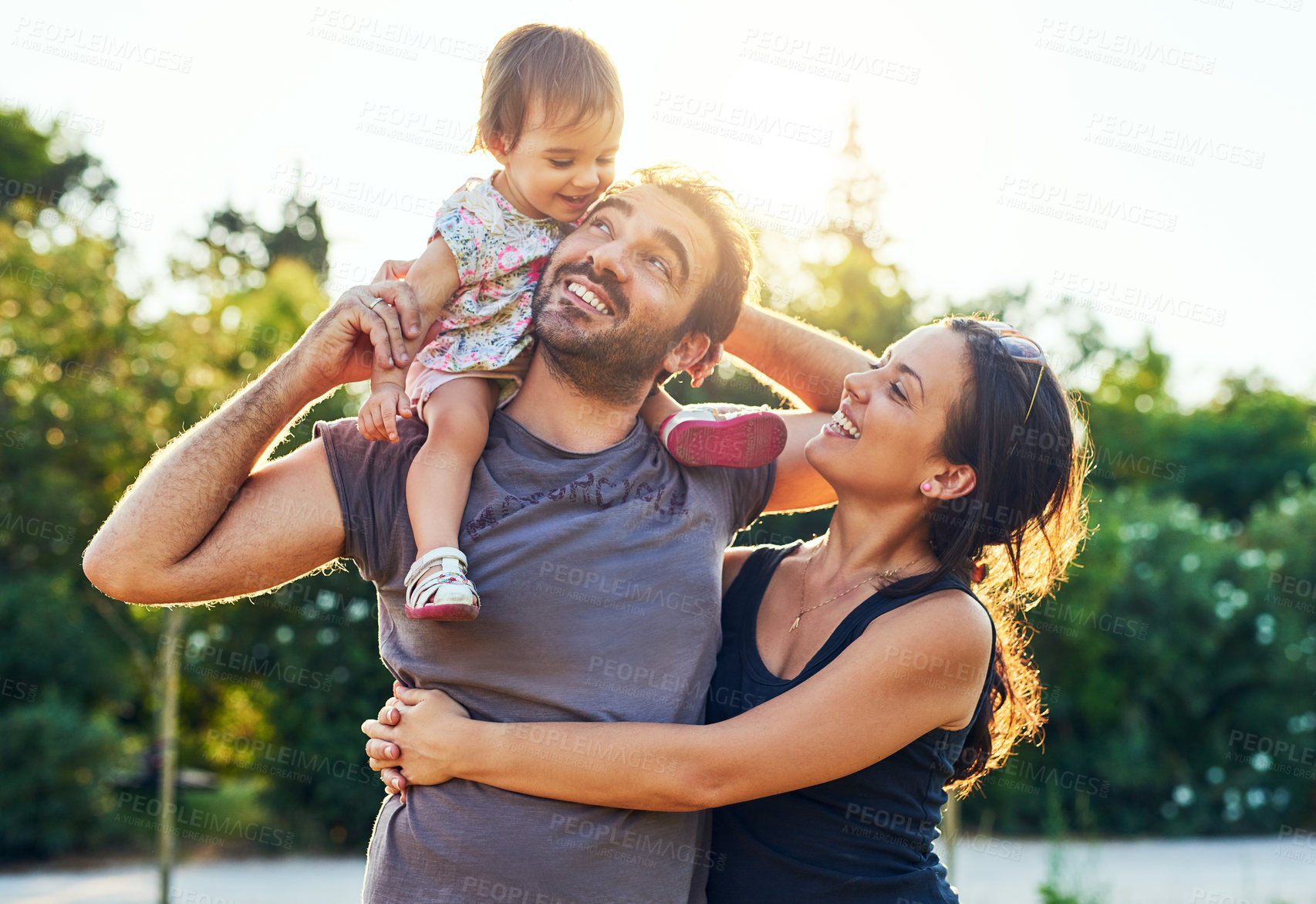 Buy stock photo Shot of a young family outdoors