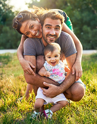 Buy stock photo Shot of a young family outdoors