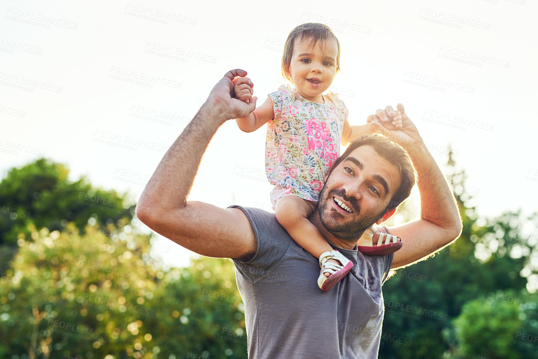 Buy stock photo Girl, baby and dad in park with shoulders, holding hands or playful bonding on vacation in summer. Father, child and happy for love, care and portrait on walk in garden, nature or outdoor in sunshine