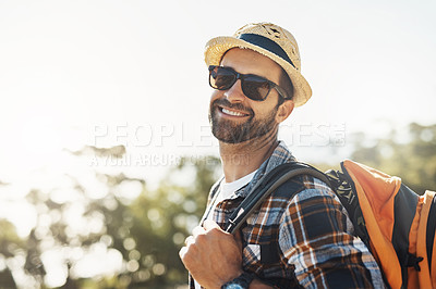 Buy stock photo Cropped portrait of a handsome young man hiking in the mountains