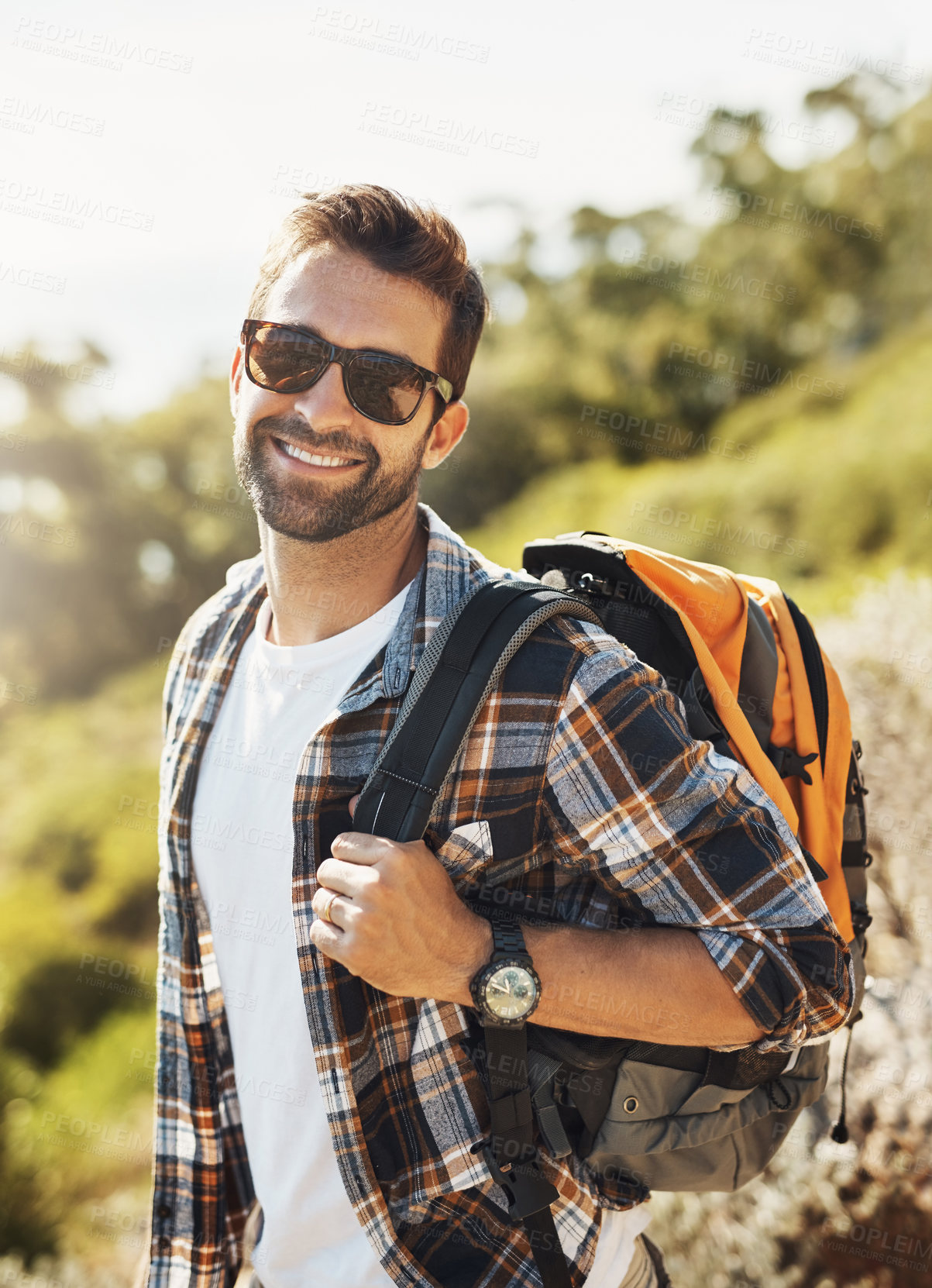 Buy stock photo Backpack, nature and man hiking on vacation for adventure, travel or journey with smile in New Zealand. Happy, sunglasses and male person trekking on outdoor trail or path on holiday or weekend trip.