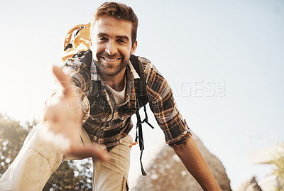 Buy stock photo Cropped portrait of a handsome young man offering you a hand while hiking in the mountains