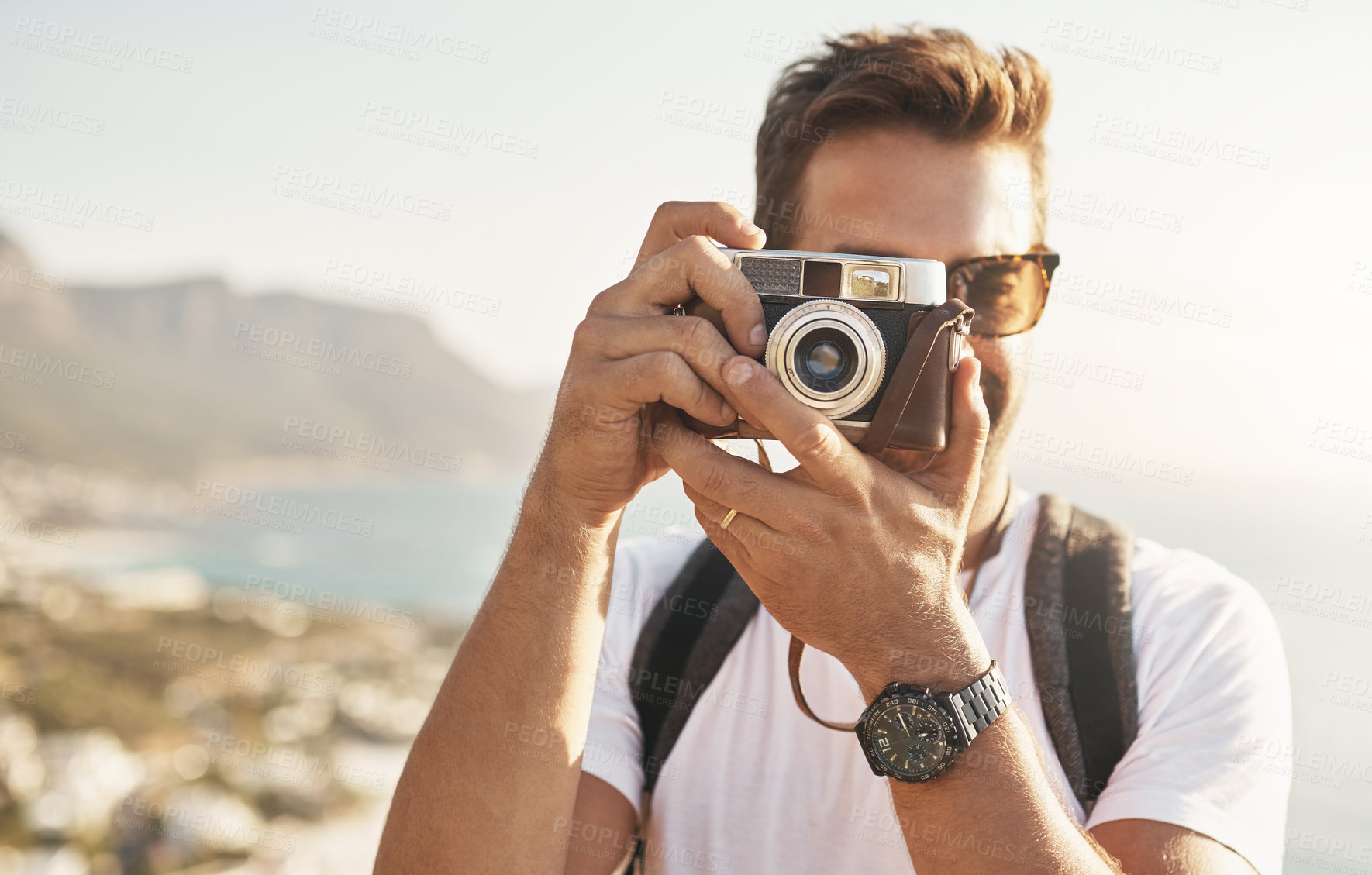 Buy stock photo Sightseeing, portrait and man with camera for photography, document experience and capture picture of nature. Travel, photographer and memory with vintage equipment on vacation, holiday and outdoor