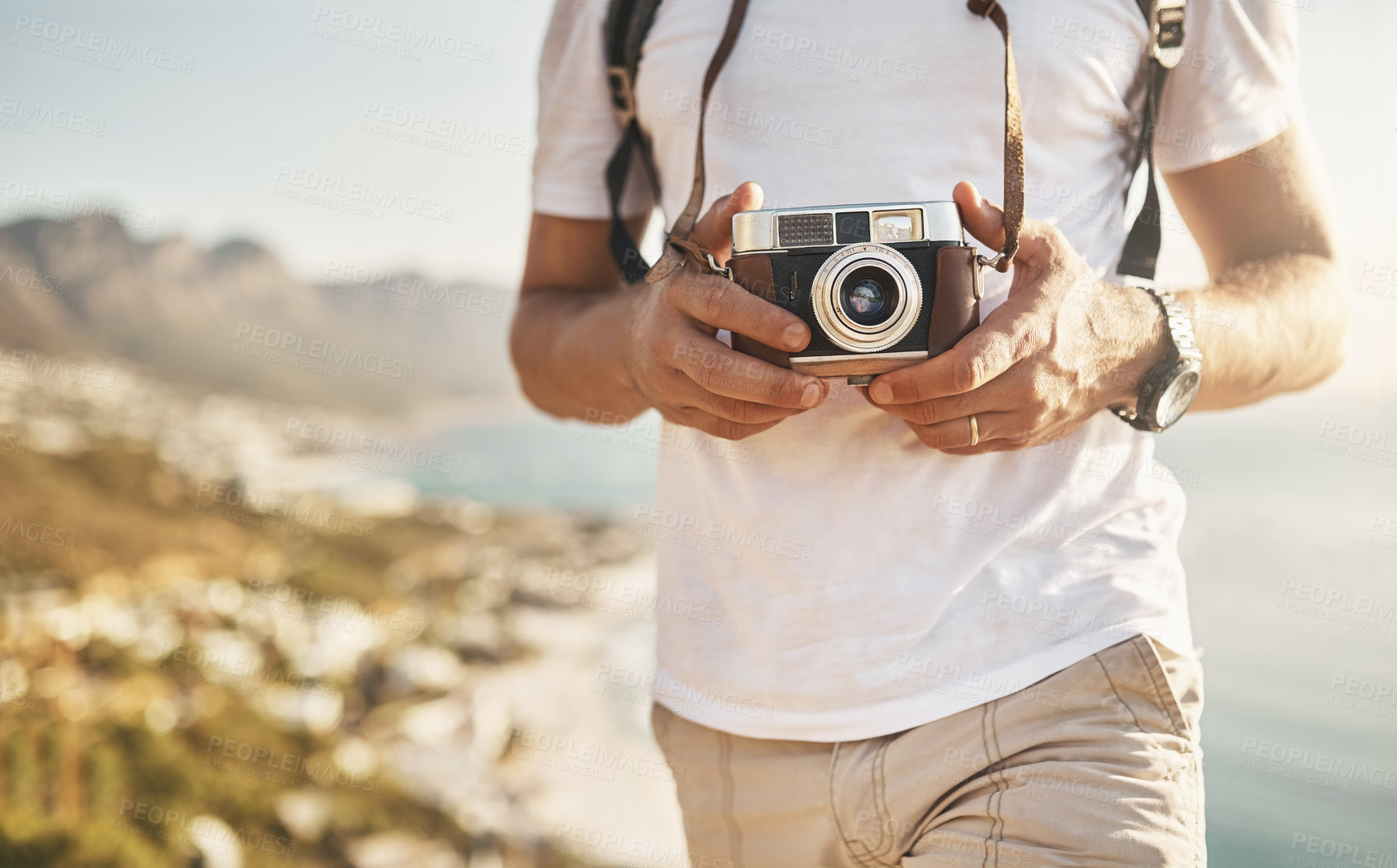 Buy stock photo Travel, hands and person with camera for photography, document experience and capture picture of nature. Space, man photographer and explore with vintage equipment on vacation, holiday and memory