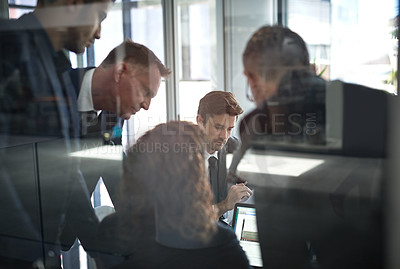 Buy stock photo Shot of businesspeople having a meeting in the office