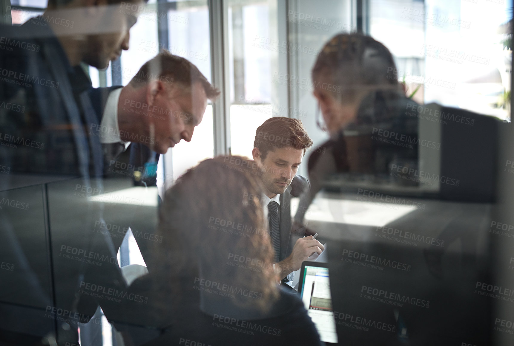 Buy stock photo Shot of businesspeople having a meeting in the office