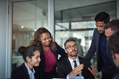 Buy stock photo Shot of businesspeople having a meeting in the office