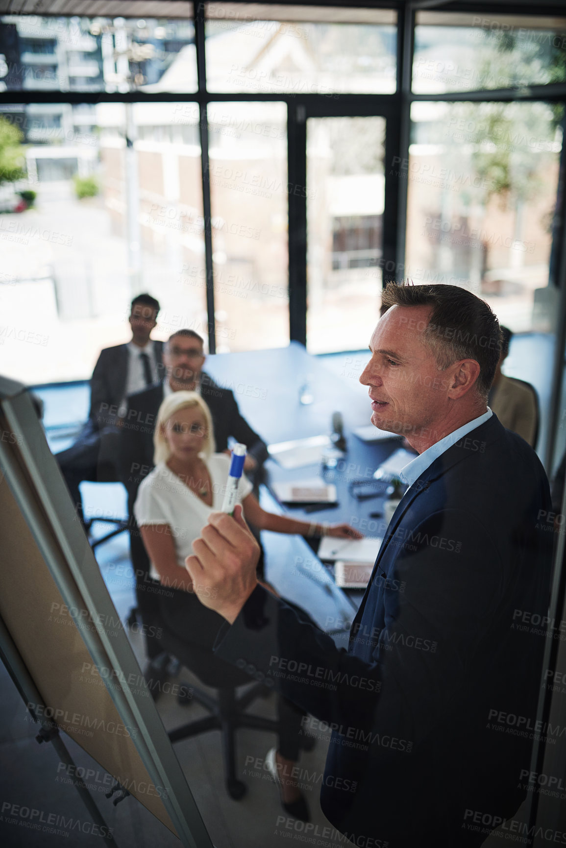 Buy stock photo Shot of businesspeople having a meeting in the office