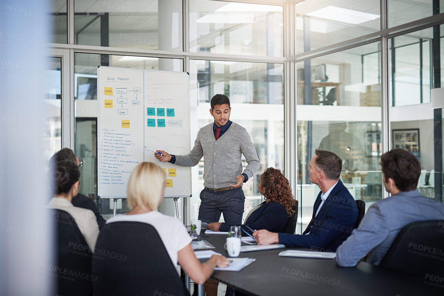 Buy stock photo Shot of businesspeople having a meeting in the office