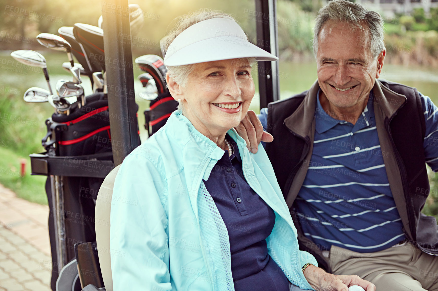 Buy stock photo Senior man, portrait and woman in golf cart for sports, game and outdoor on weekend, bonding and fitness. Couple, love and happy on course for exercise, smile and club in retirement for leisure