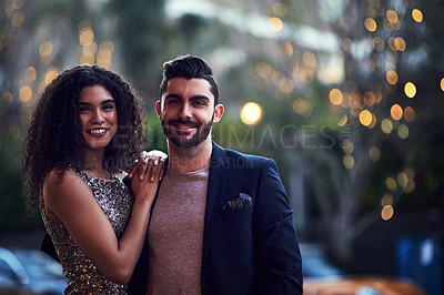Buy stock photo Portrait, love and date with a couple on a night out in the city together for romance or celebration. Elegant, nightlife or dating with a young man and woman standing outside for bonding or affection