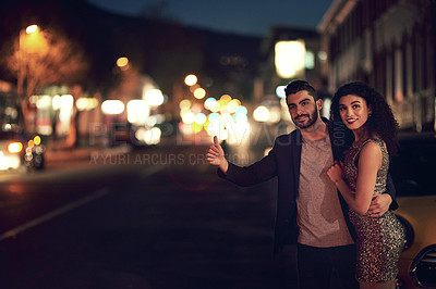 Buy stock photo Date, night and couple hailing a taxi in the city for transport on an anniversary or honeymoon. Waiting, happy and interracial man and woman calling for a car for transportation on valentines day