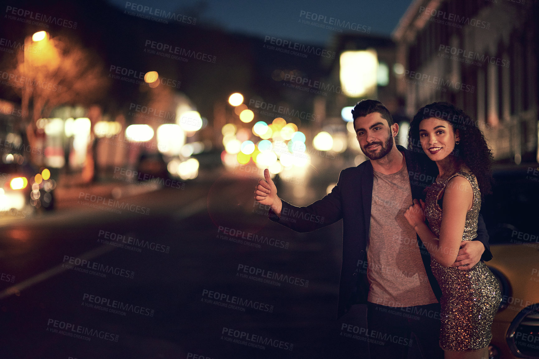 Buy stock photo Date, night and couple hailing a taxi in the city for transport on an anniversary or honeymoon. Waiting, happy and interracial man and woman calling for a car for transportation on valentines day