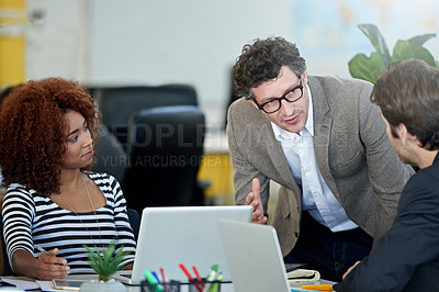 Buy stock photo Manager, man and employee for conversation in office, colleagues and teaching in workplace. Leader, ceo and computers for communication with staff, web designer and online for project and teamwork 