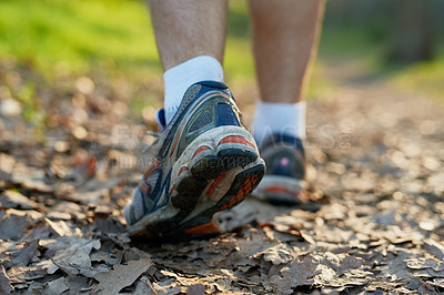 Buy stock photo Hike, man or athlete walking in forest for exercise, trekking or summer adventure for health and fitness. Male person, outdoor and sports shoes on for performance, morning cardio and exploring nature