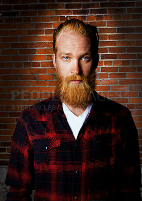 Buy stock photo Man, portrait and confident clothes by brick wall, pride and flannel or plaid for trend. Male person, serious face and farmer guy or casual outfit for aesthetic, designer shirt and weekend travel