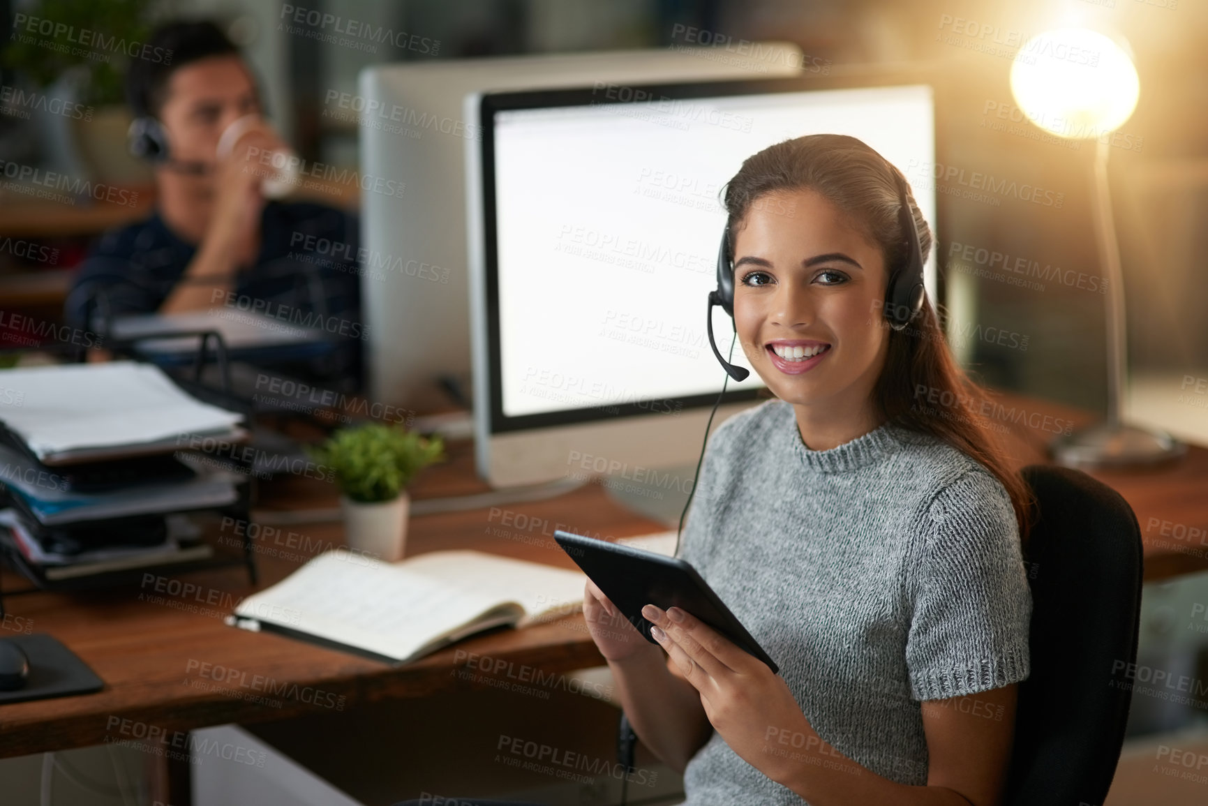 Buy stock photo Shot of young agents working in a call center