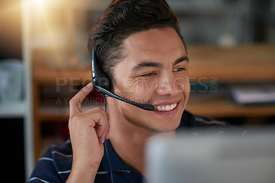 Buy stock photo Shot of a young male agent working in a call center