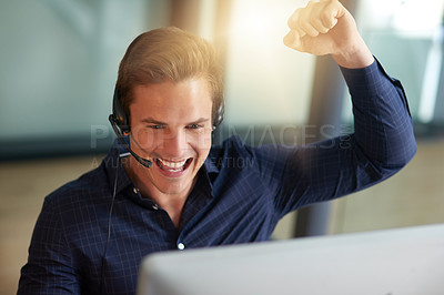Buy stock photo Shot of a young male agent working in a call center