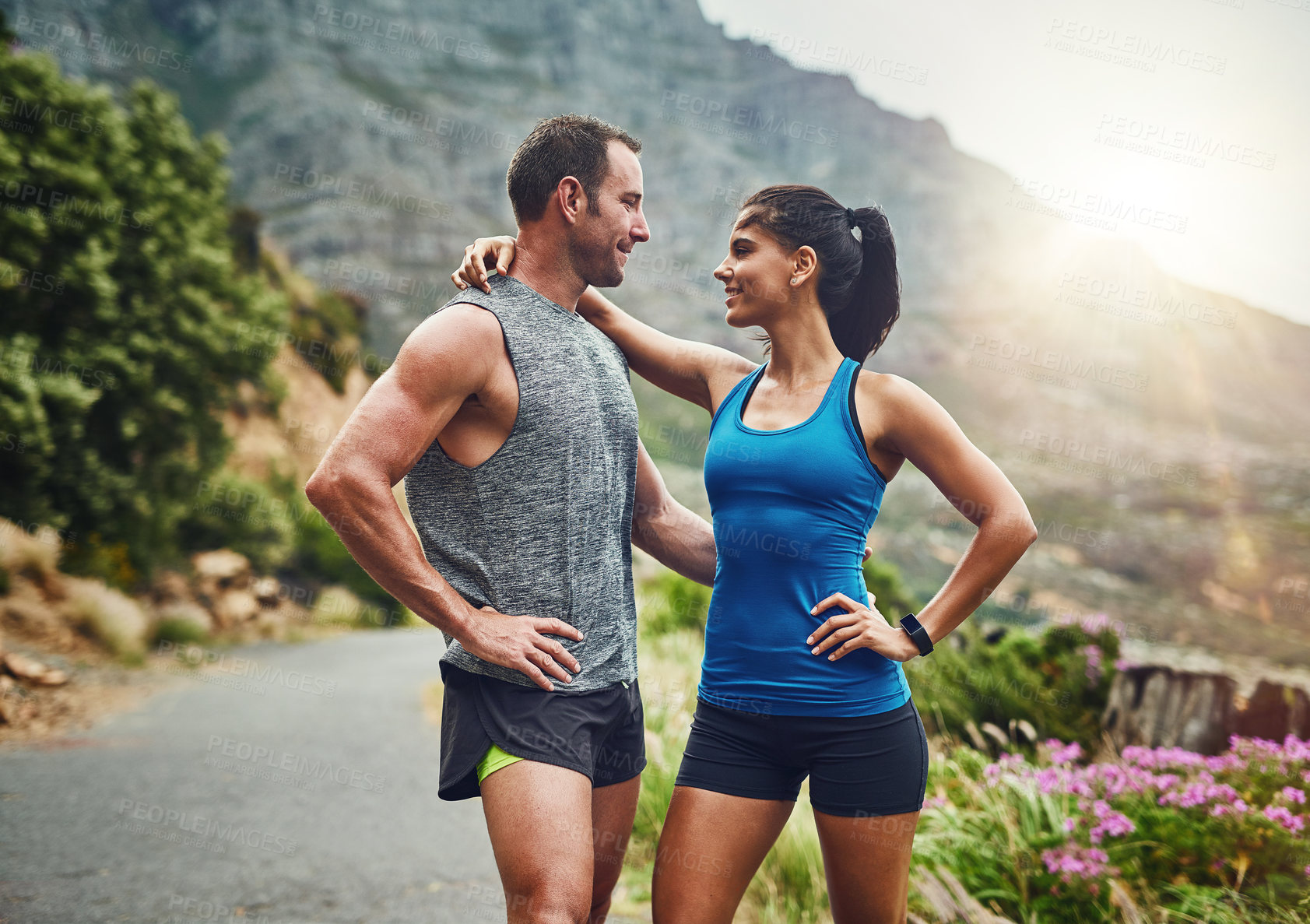 Buy stock photo Couple, hug and fitness in nature with love, hold and exercise on mountain trail. Happy man, woman and together at sunrise for wellness, training and support in sportswear for motivation or marathon