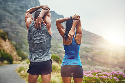 Buy stock photo Back, fitness and stretching with a sports couple outdoor in nature for a cardio or endurance workout. Exercise, warm up or getting ready with a man and woman athlete training together in nature