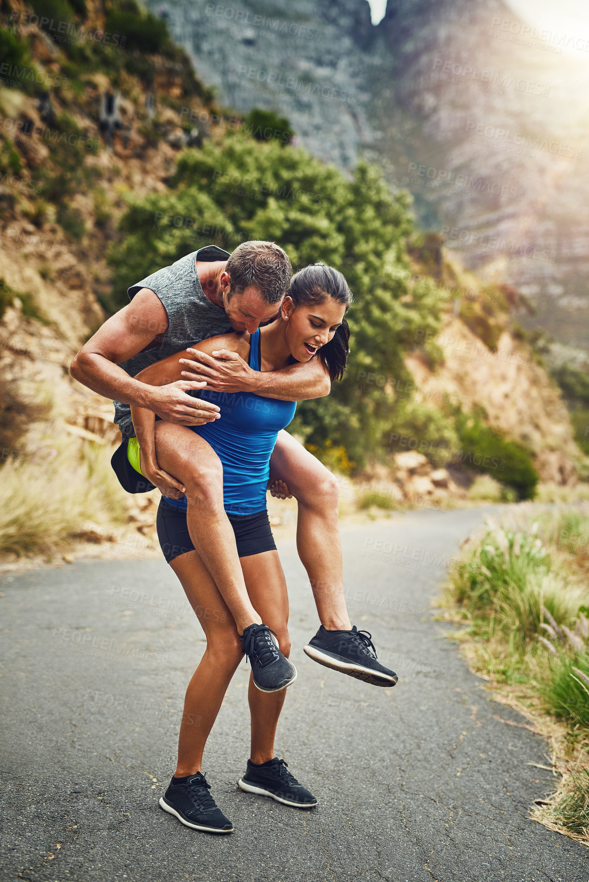 Buy stock photo Piggyback, fitness and runner couple in nature for marathon training, cardio workout or physical challenge. Playing, sports and woman carrying man on mountain for exercise, wellness or endurance