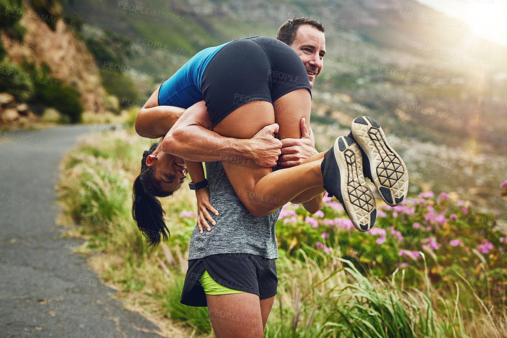 Buy stock photo Carry, exercise and runner couple in nature for marathon training, cardio workout or physical challenge. Playing, sports and athlete man with woman on mountain for fitness, wellness or endurance